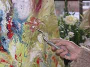 Melody Painting Birthday Bouquet in her art studio, a floral abstraction painted with palette knife and oil paint
