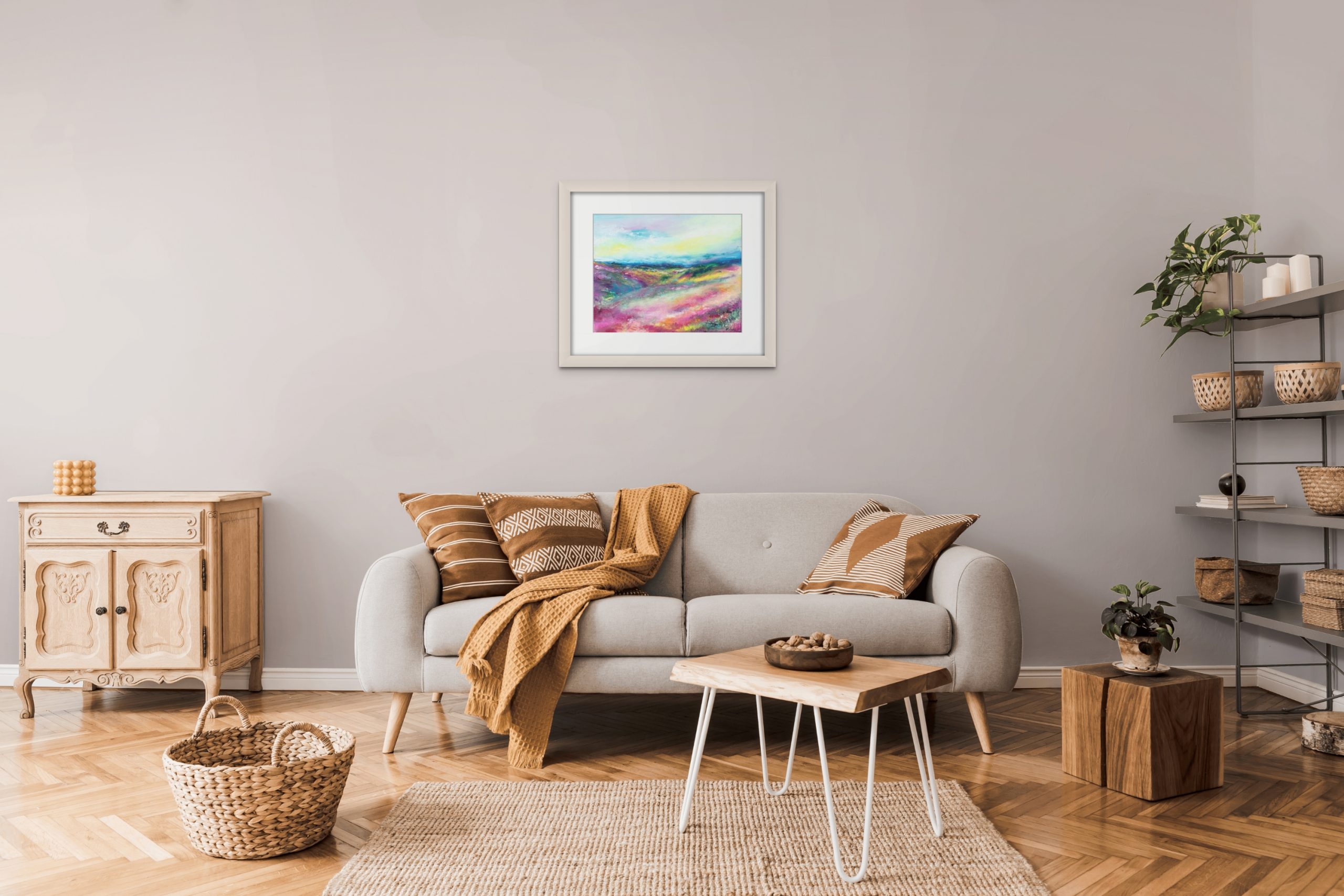 Love Exmoor colourful contemporary landscape painting on paper with frame hanging in living room above settee
