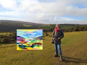 Melody on location with her colourful landscape painting in oil on canvas titled Valentine on Exmoor