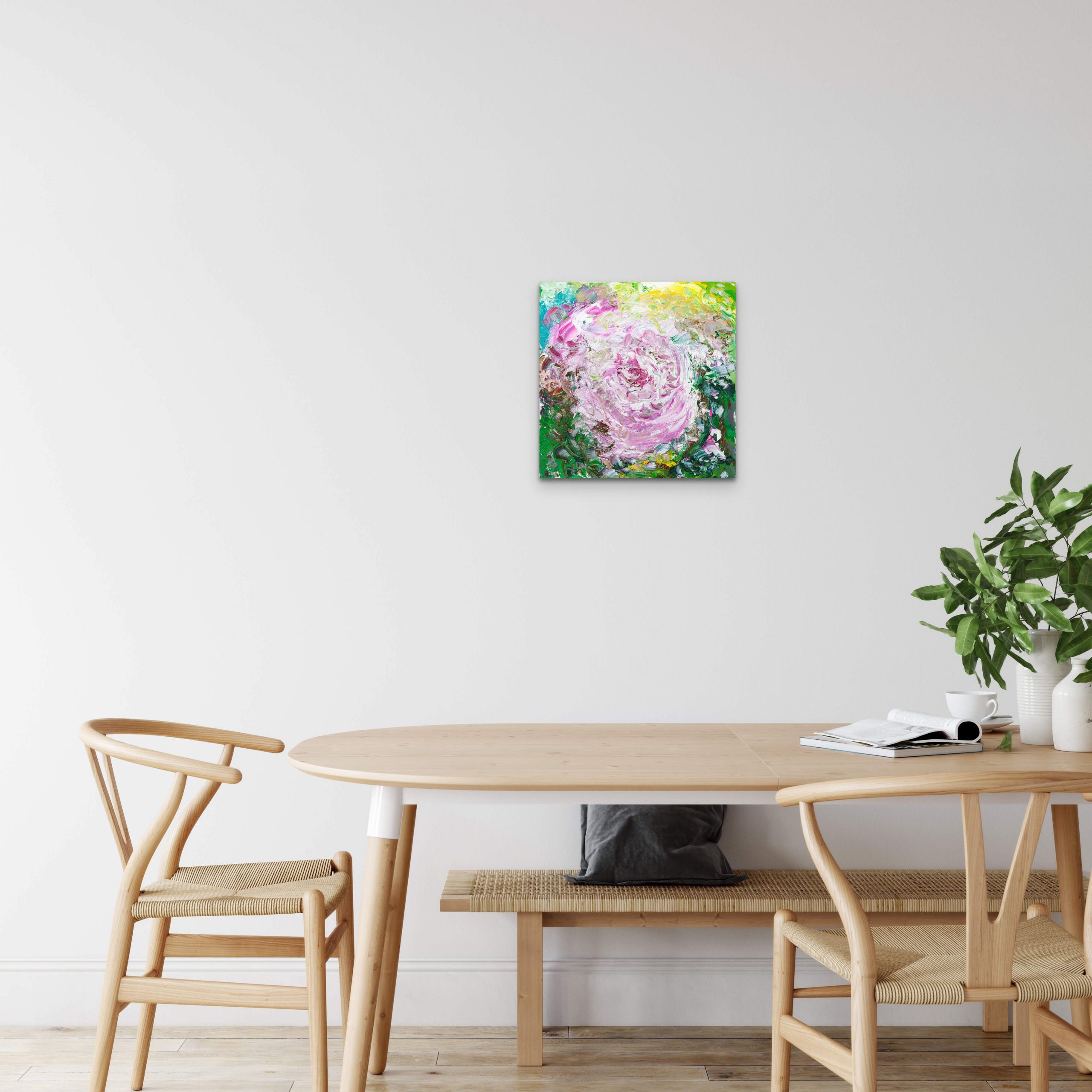 My Rose original oil painting of a flower in bloom hanging above a dinning table
