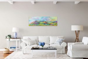 Colourful contemporary Exmoor landscape painting of Selworthy Beacon over sofa with lamps and coffee table